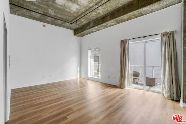 unfurnished room featuring wood-type flooring