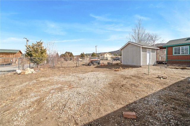 view of yard with a storage unit