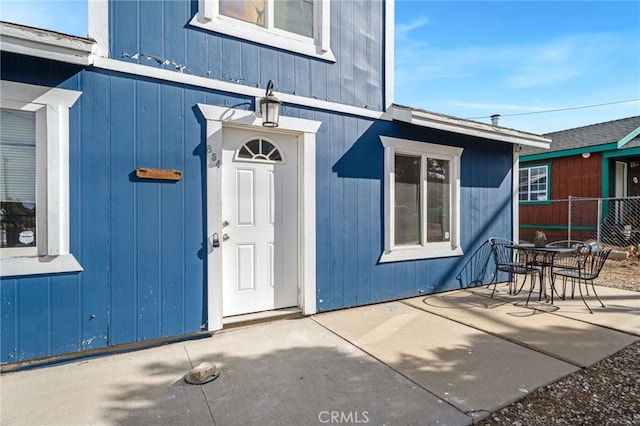 entrance to property featuring a patio area