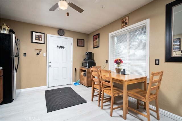 dining space with ceiling fan