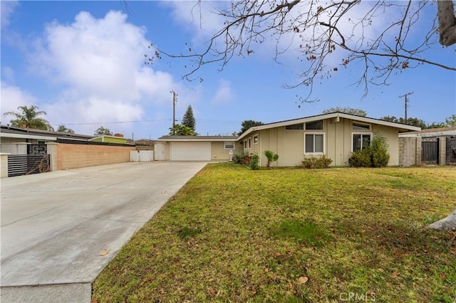 ranch-style house featuring a garage and a front yard