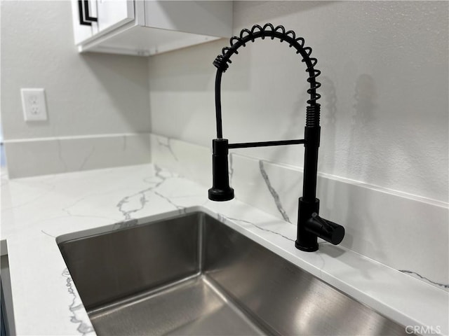 interior details with light stone counters and sink