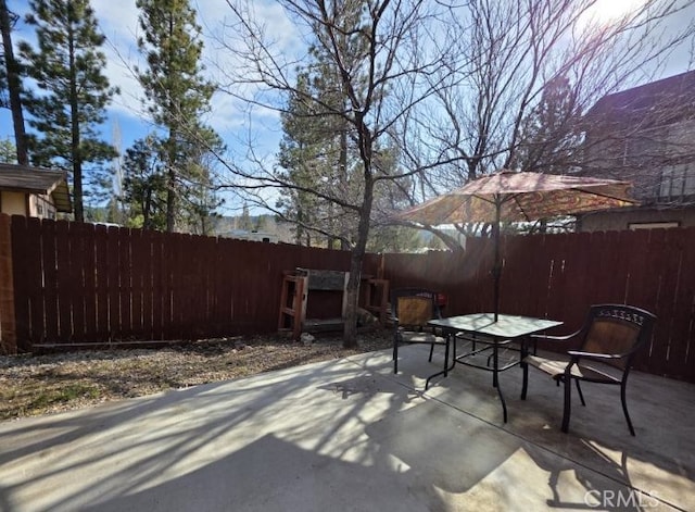view of patio / terrace featuring a fenced backyard and outdoor dining space