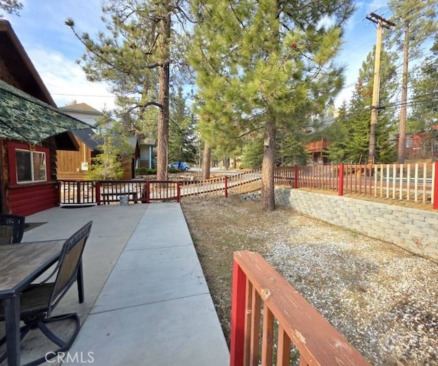 view of yard featuring a patio and fence