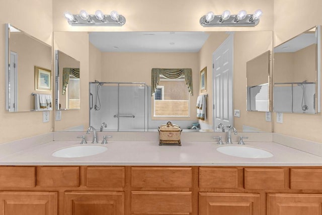 bathroom featuring vanity and a shower with shower door