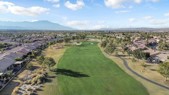 birds eye view of property with a mountain view