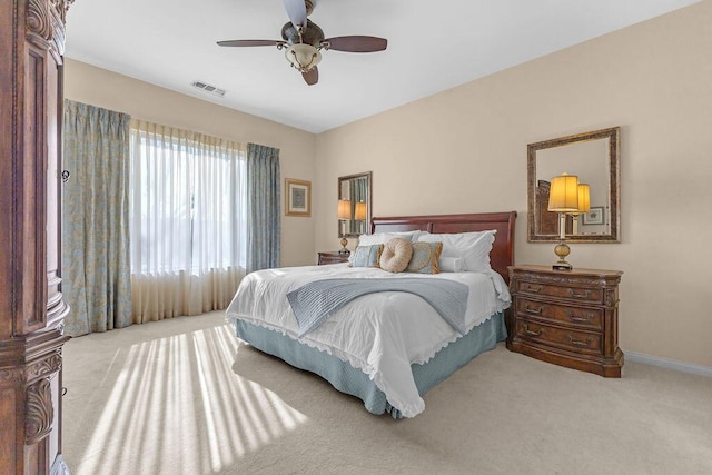 bedroom with light carpet and ceiling fan