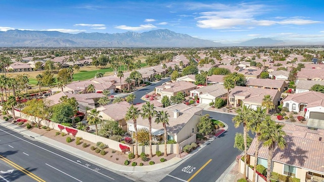 birds eye view of property with a mountain view