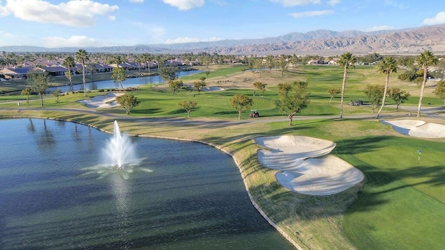 exterior space with a water and mountain view