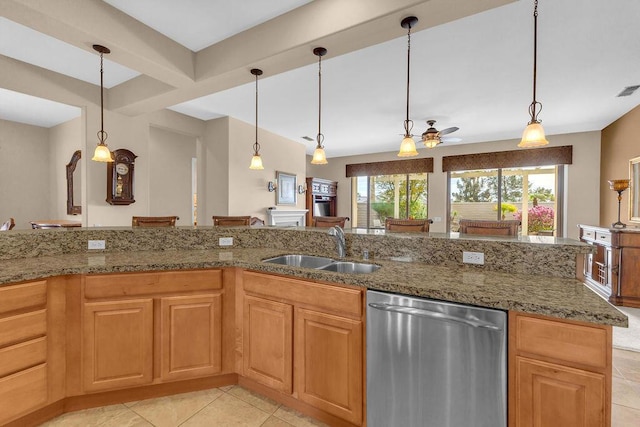 kitchen with light stone counters, dishwasher, sink, and hanging light fixtures