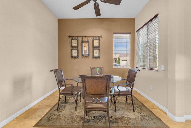 dining area featuring light tile patterned floors and ceiling fan