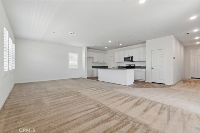 24583 Acadia Dr, Corona, CA 92883 - unfurnished living room with light carpet and recessed lighting