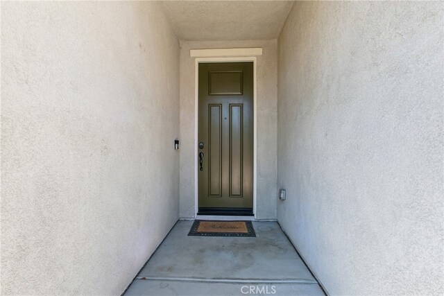 24583 Acadia Dr, Corona, CA 92883 - view of exterior entry featuring stucco siding