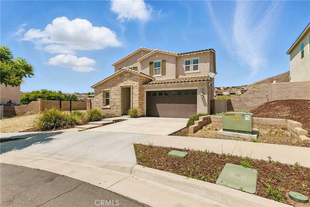 24583 Acadia Dr, Corona, CA 92883 - view of front of home with concrete driveway, stucco siding, stone siding, a tile roof, and an attached garage