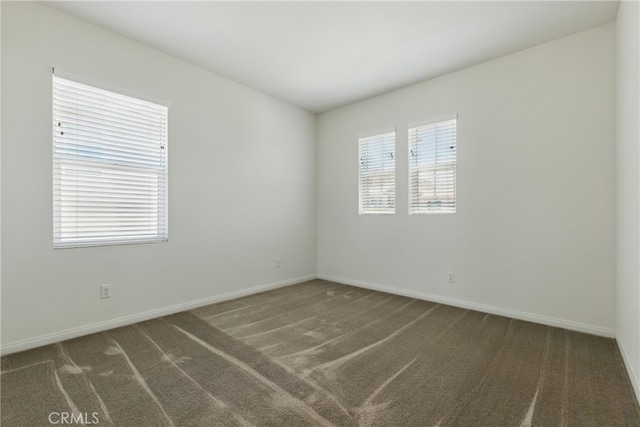 24583 Acadia Dr, Corona, CA 92883 - carpeted empty room featuring baseboards
