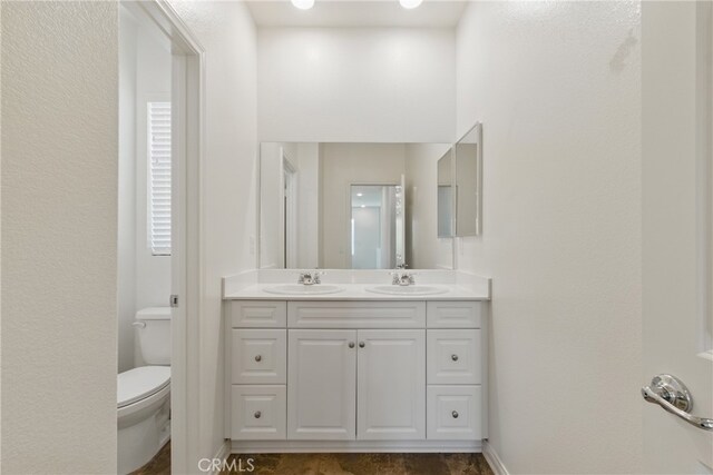 24583 Acadia Dr, Corona, CA 92883 - bathroom with double vanity and toilet