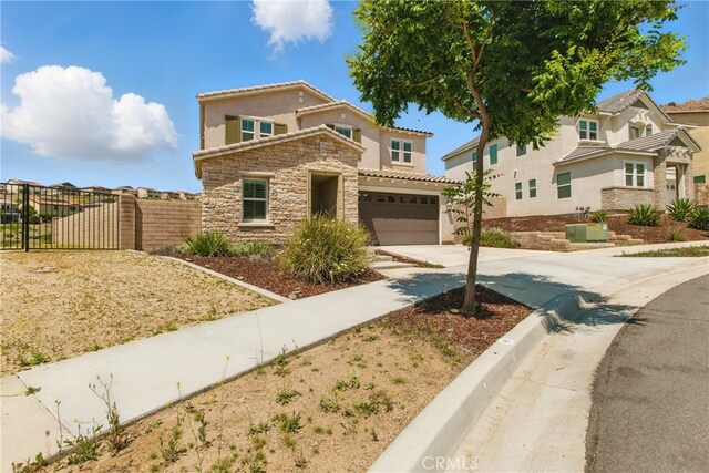 24583 Acadia Dr, Corona, CA 92883 - view of front of home with concrete driveway, an attached garage, stucco siding, and stone siding