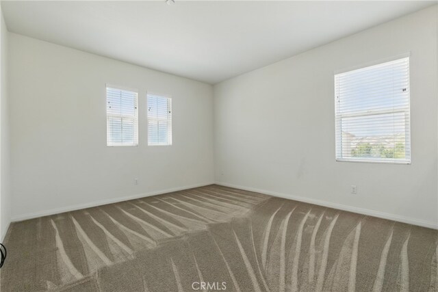 24583 Acadia Dr, Corona, CA 92883 - carpeted spare room featuring baseboards