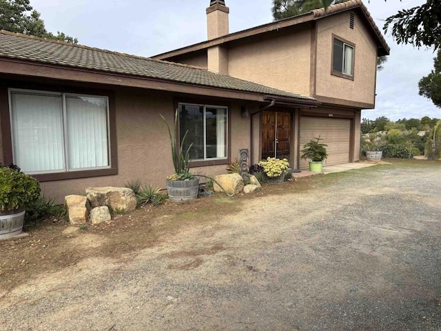 view of property exterior with a garage