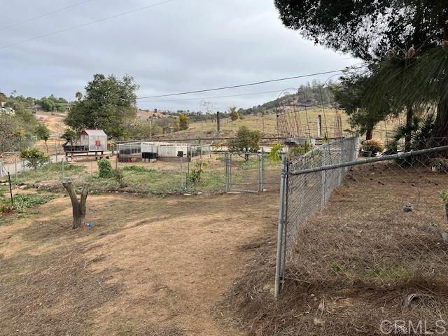 view of yard with a rural view