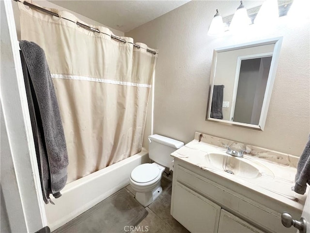 full bath with shower / bath combo, vanity, toilet, and tile patterned floors