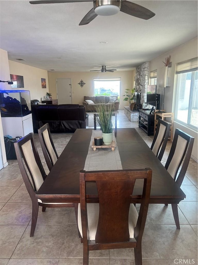 14376 Rivers Edge Rd, Helendale, CA 92342 - dining area featuring ceiling fan, light tile patterned floors, and a wealth of natural light