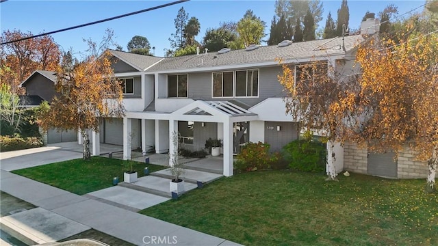 view of front facade with a garage and a front yard