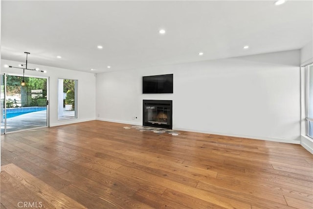 unfurnished living room with light wood-type flooring