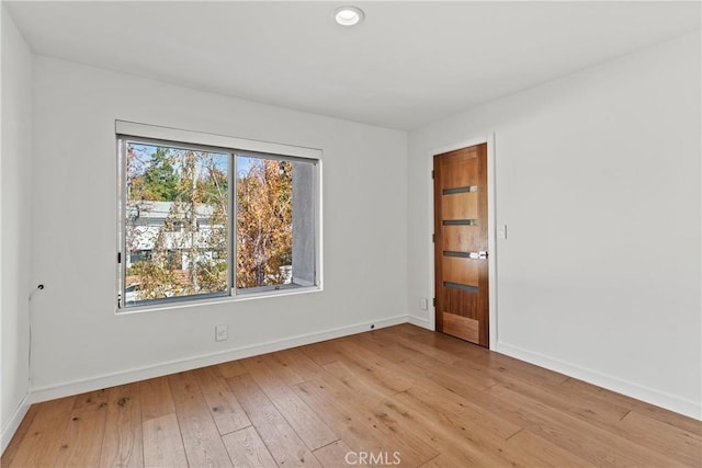 unfurnished room featuring light hardwood / wood-style flooring