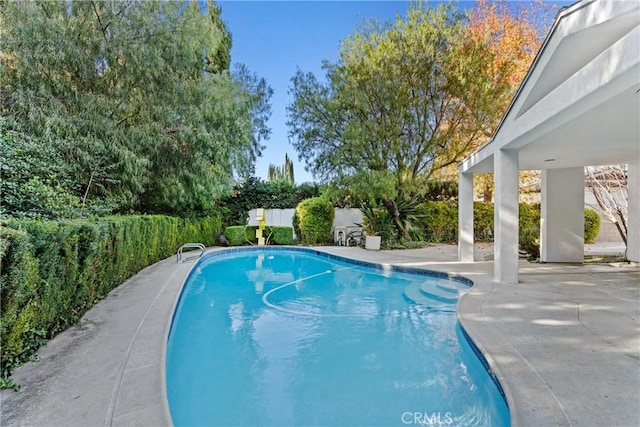 view of swimming pool featuring a patio area