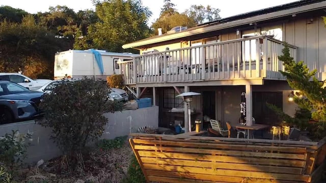 back of house with a balcony