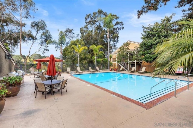 view of swimming pool featuring a patio