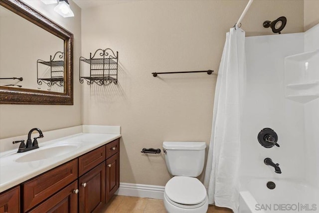 full bathroom with shower / tub combo with curtain, vanity, toilet, and tile patterned floors