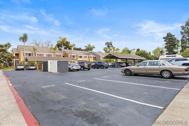 view of car parking featuring a carport