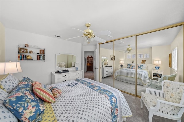 bedroom featuring ceiling fan, carpet floors, and a closet