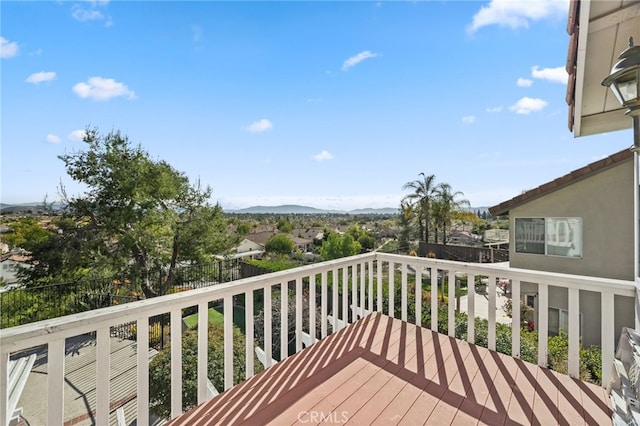 wooden deck with a mountain view