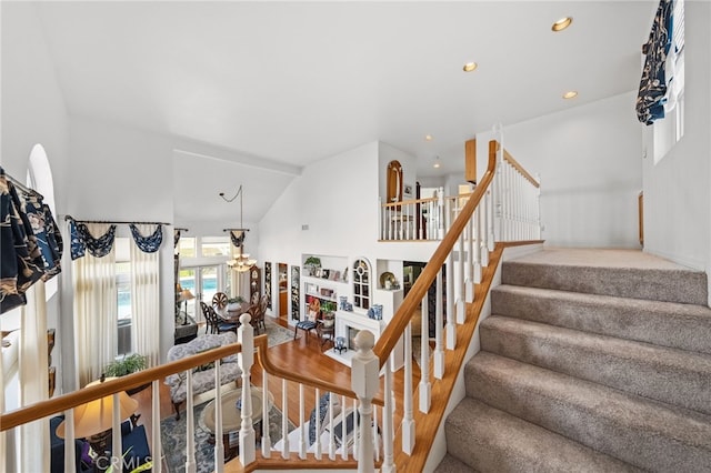 stairway with vaulted ceiling