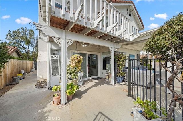 view of patio featuring a balcony