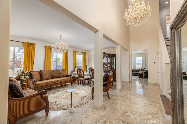 interior space featuring a high ceiling and a notable chandelier