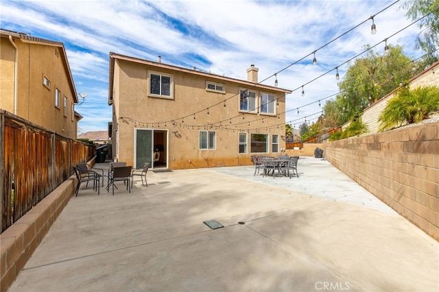 rear view of property with a patio area