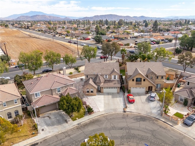 birds eye view of property with a mountain view