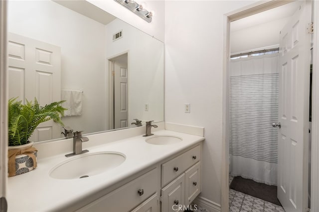 bathroom with vanity and a shower with curtain