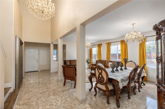 dining space featuring an inviting chandelier