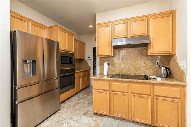 kitchen with stainless steel appliances, backsplash, and light stone counters