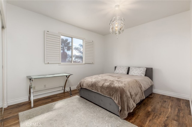 bedroom with dark hardwood / wood-style flooring