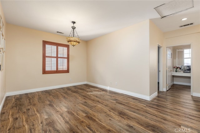 empty room featuring dark hardwood / wood-style flooring