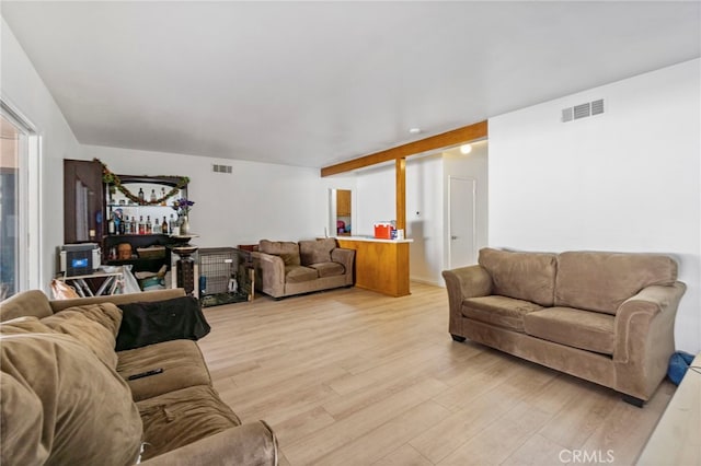 living room with light hardwood / wood-style floors