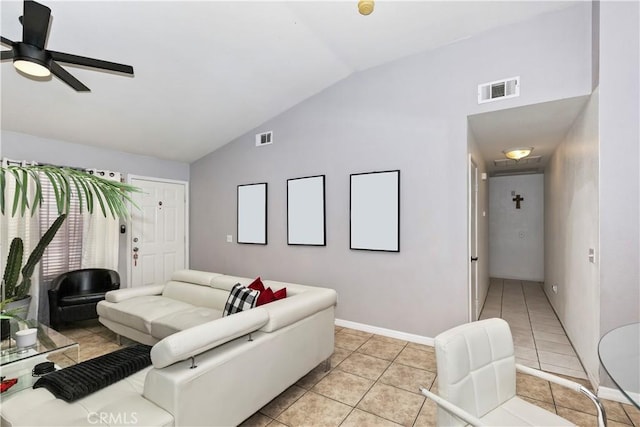 tiled living room with ceiling fan and lofted ceiling