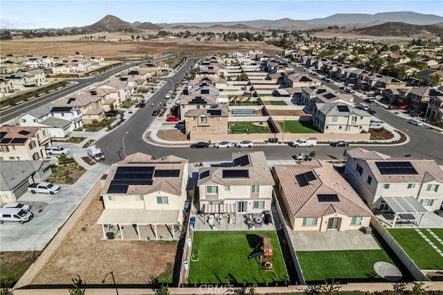 birds eye view of property with a mountain view