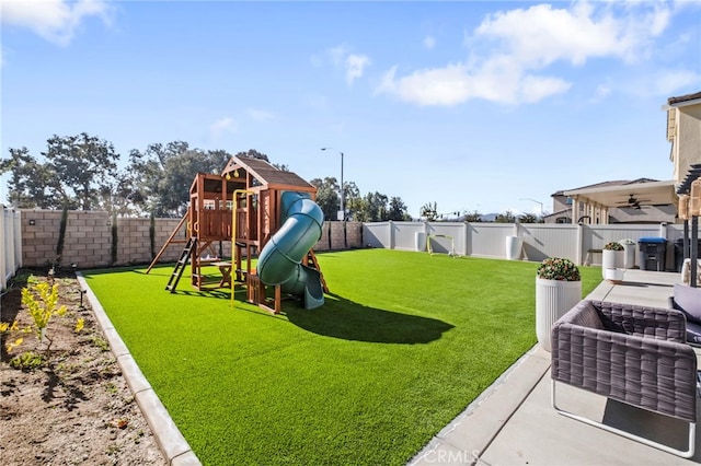 view of yard with a playground and a patio